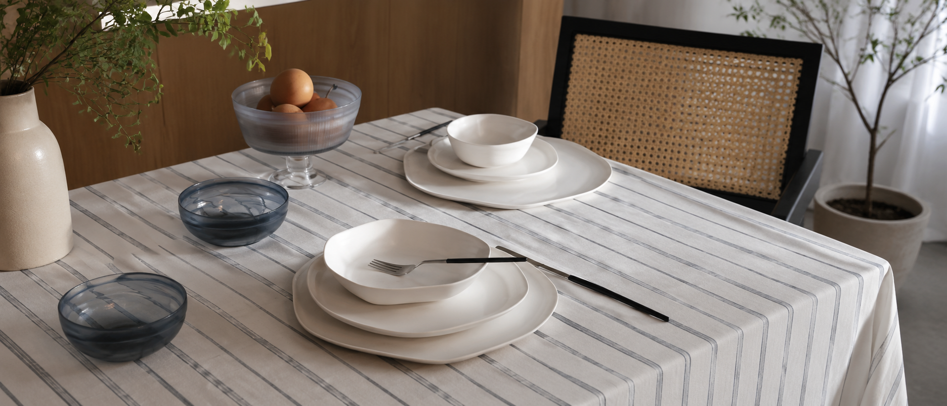 Warm table setting with plates and serving pieces