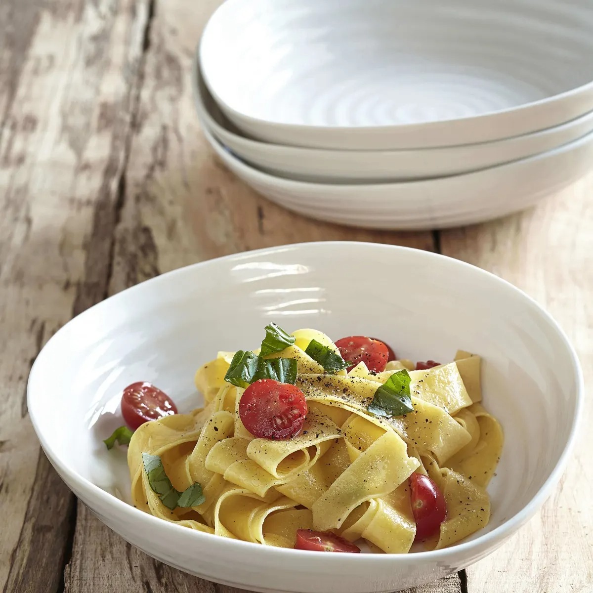 A relaxed breakfast table with ceramic bowls