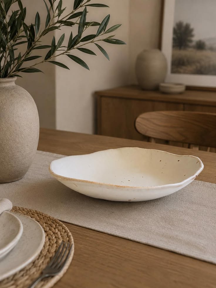 Ceramic plates and bowls arranged for everyday dining